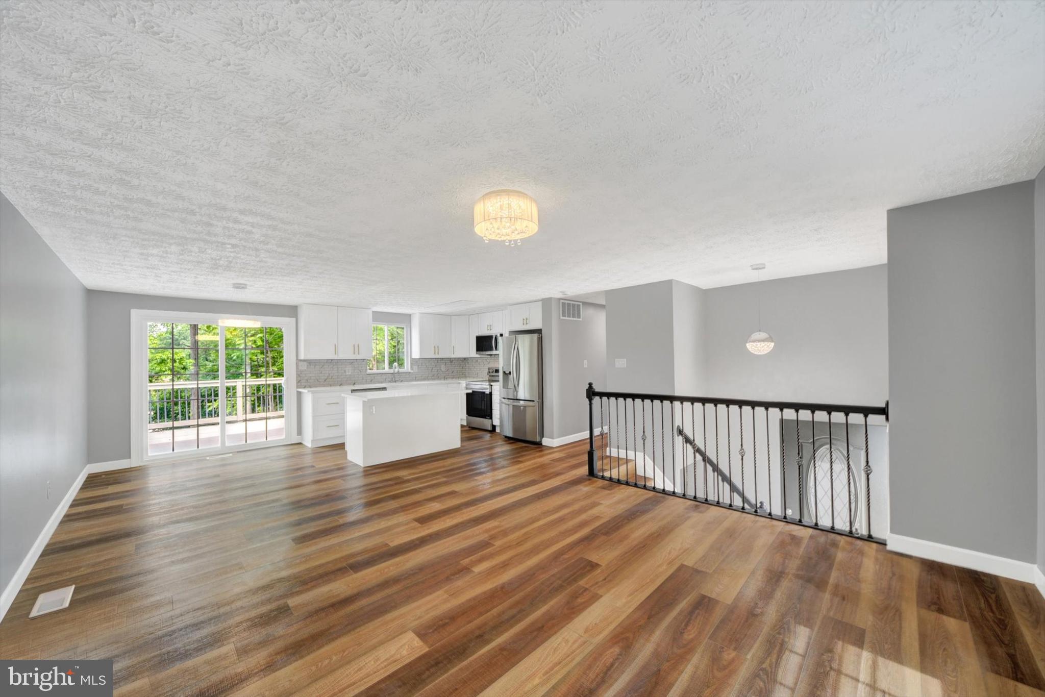 220 Sandhill Road Baltimore, MD 21221 - Photo 4 of 30 a view of a livingroom with furniture wooden floor and window