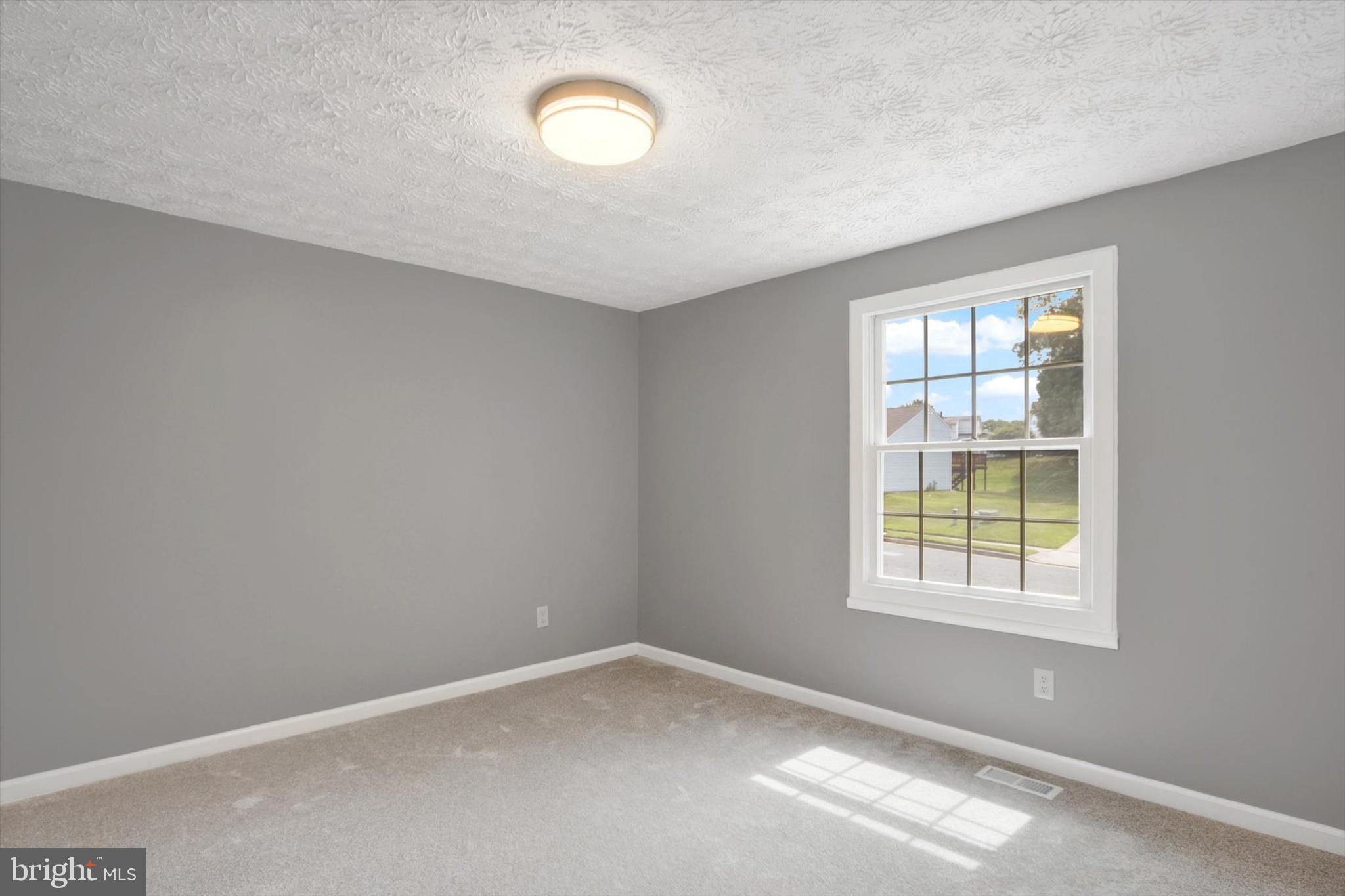 220 Sandhill Road Baltimore, MD 21221 - Photo 8 of 30 an empty room with a window