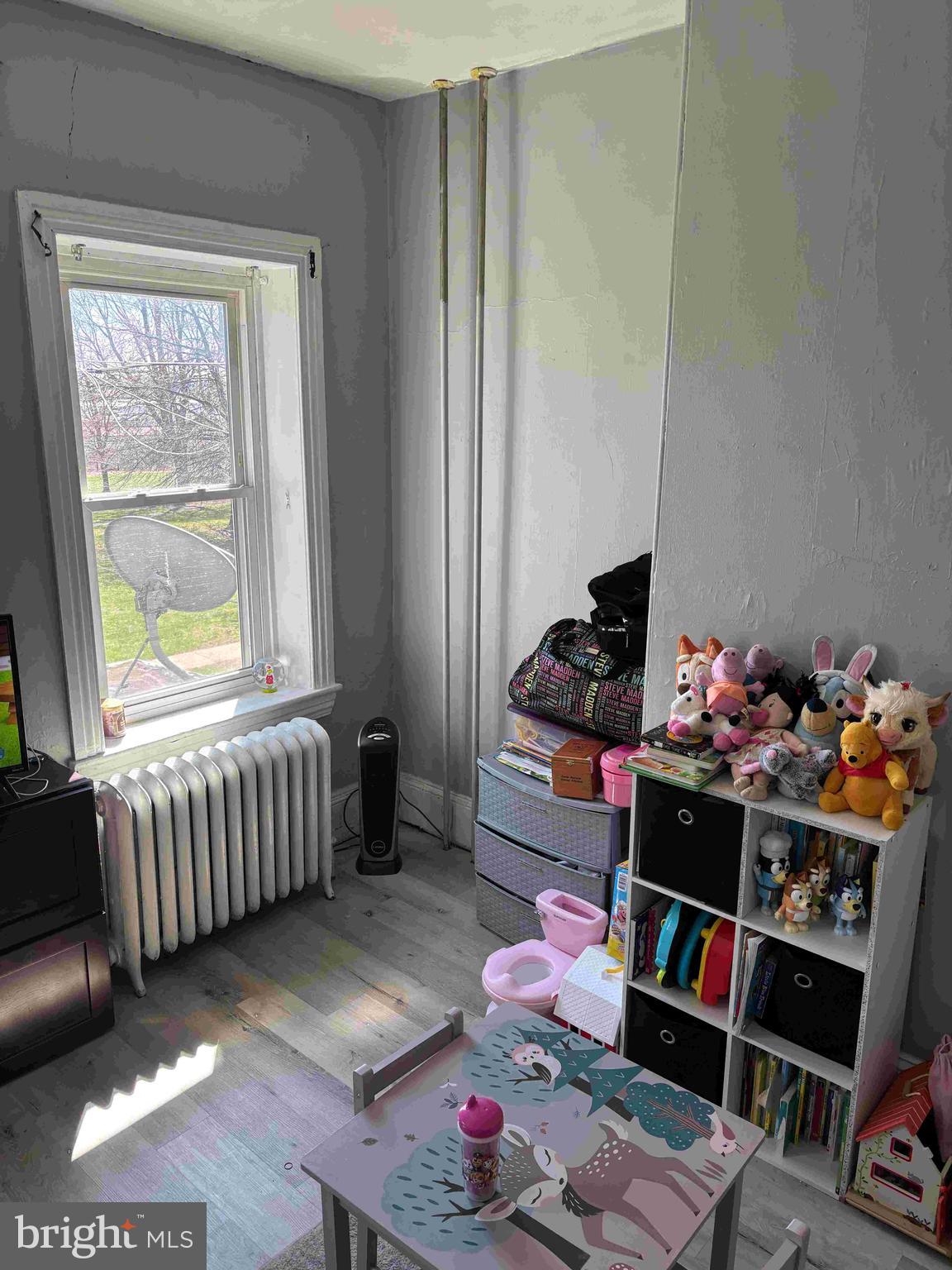 6740 Keystone Street Philadelphia, PA 19135 - Photo 2 of 14 a bedroom with bed and a window