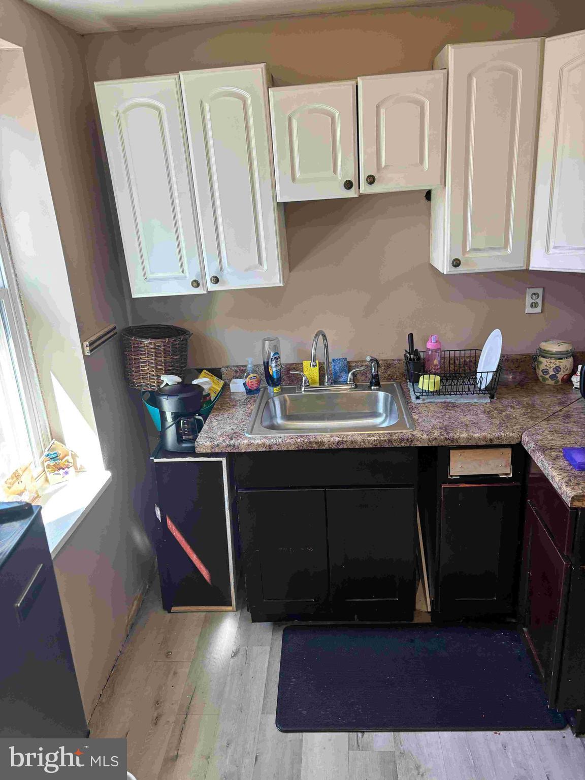 6740 Keystone Street Philadelphia, PA 19135 - Photo 5 of 14 a kitchen with stainless steel appliances granite countertop a sink dishwasher stove and cabinets