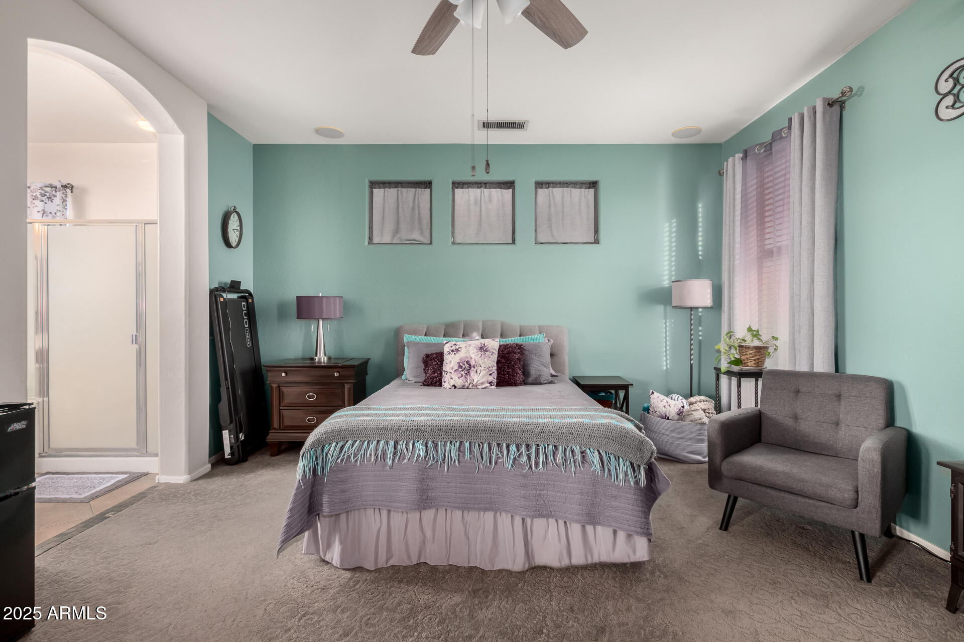 17441 West Arroyo Way Goodyear, AZ 85338 - Photo 15 of 27 a bedroom with a bed couch and a window