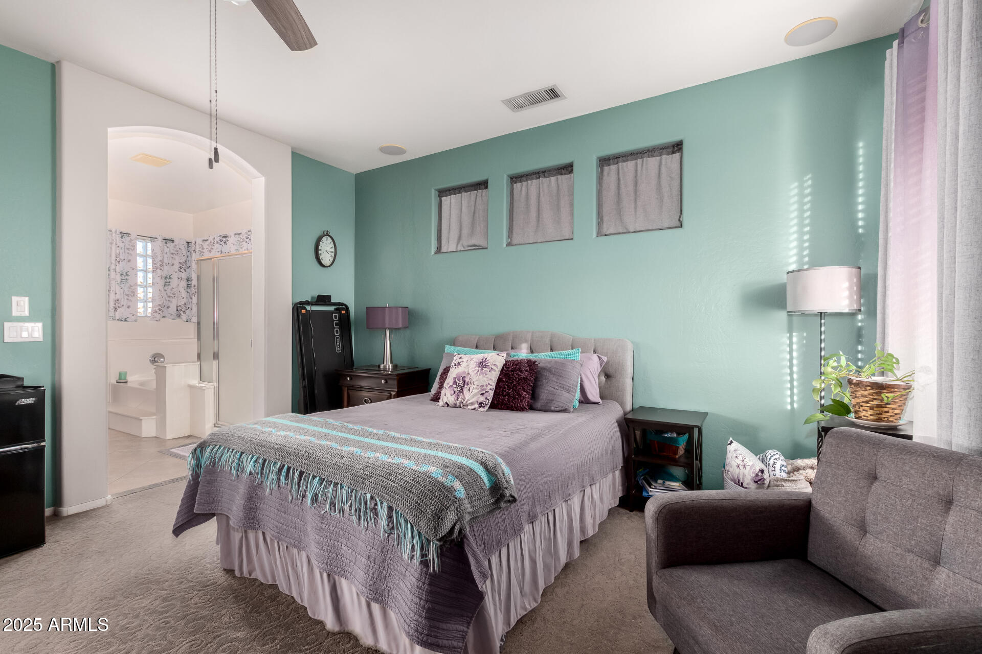 17441 West Arroyo Way Goodyear, AZ 85338 - Photo 16 of 27 a bedroom with a bed a couch and a dresser