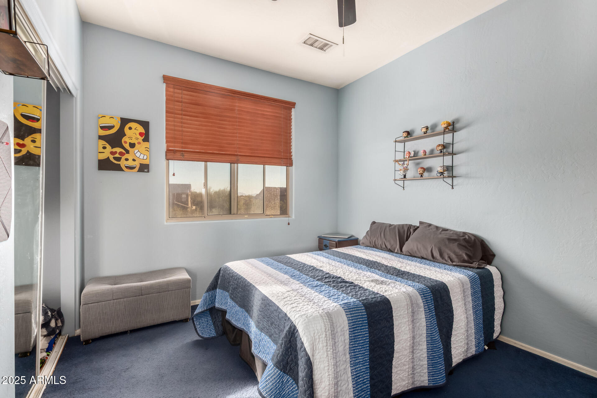 17441 West Arroyo Way Goodyear, AZ 85338 - Photo 21 of 27 a bedroom with a bed and a window