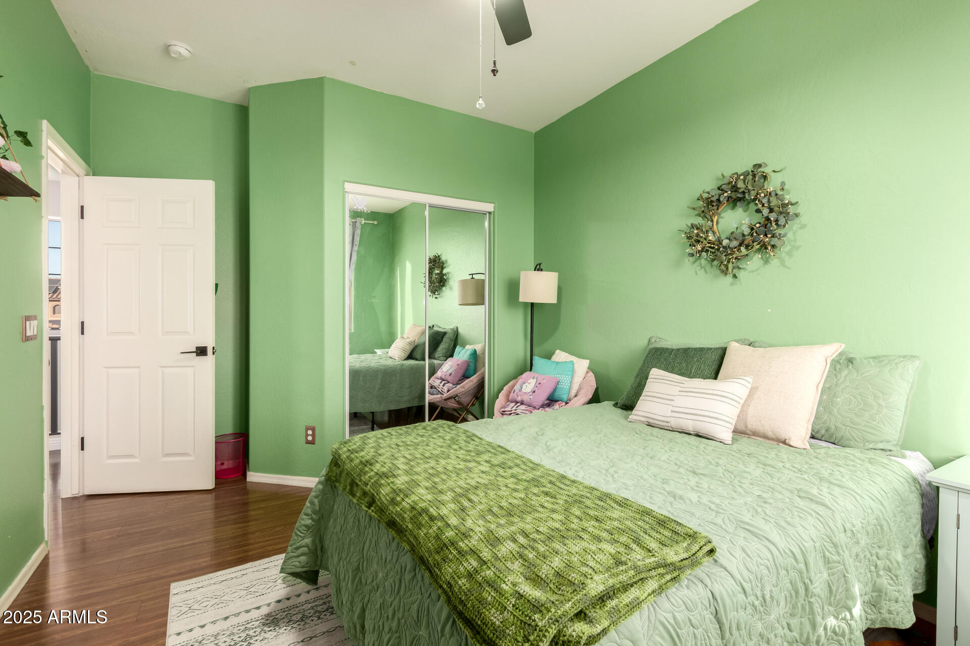 17441 West Arroyo Way Goodyear, AZ 85338 - Photo 23 of 27 a bedroom with a bed and a chandelier