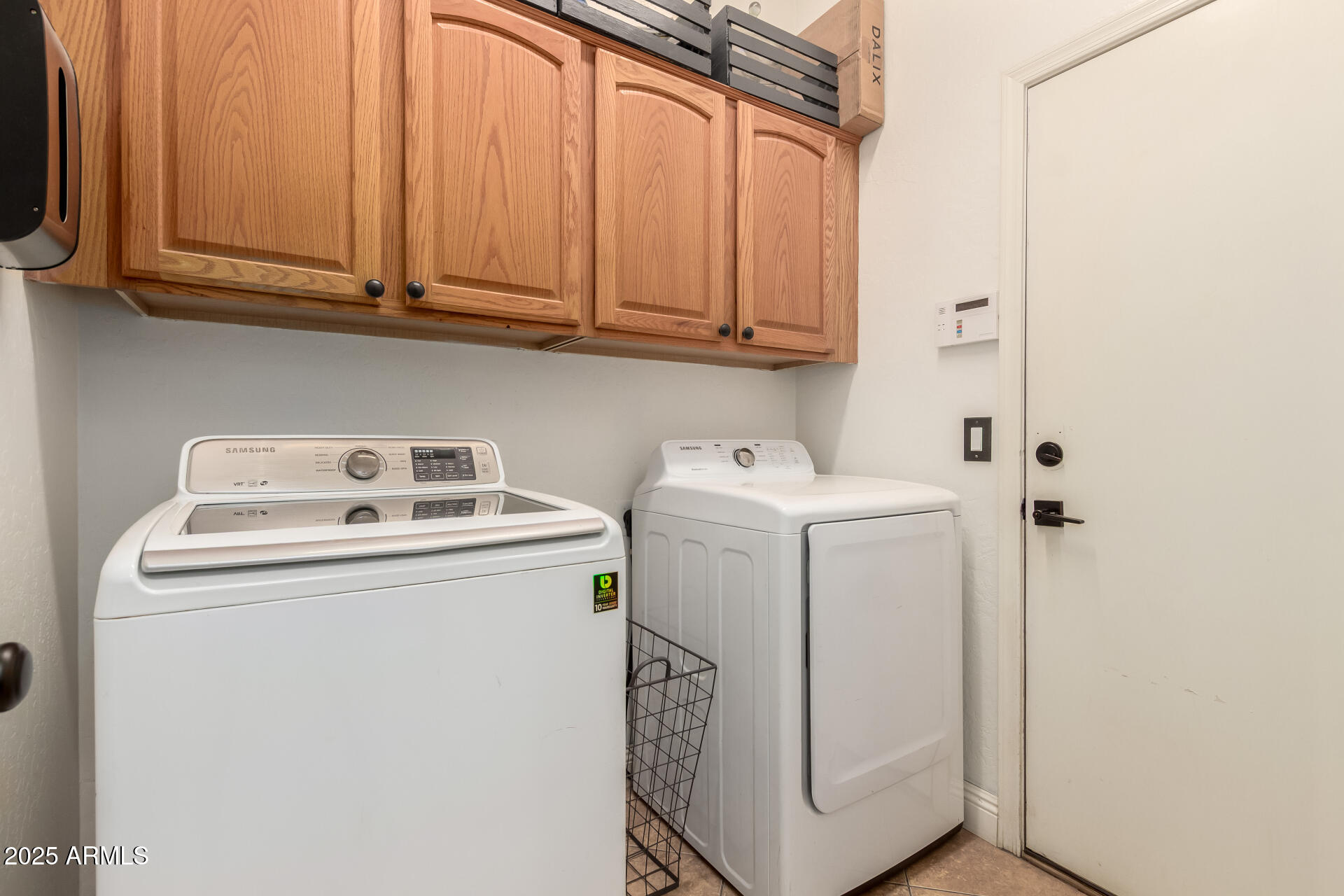 17441 West Arroyo Way Goodyear, AZ 85338 - Photo 25 of 27 a utility room with dryer and washer