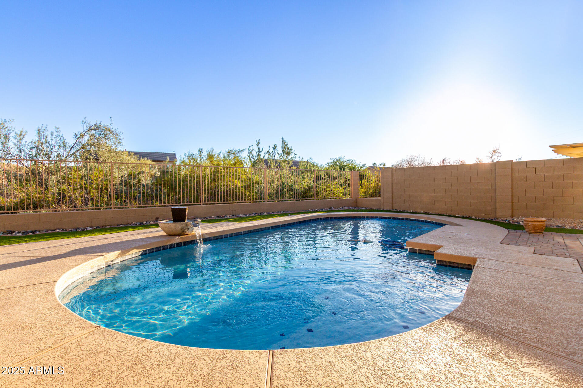 17441 West Arroyo Way Goodyear, AZ 85338 - Photo 26 of 27 a view of a swimming pool with a yard
