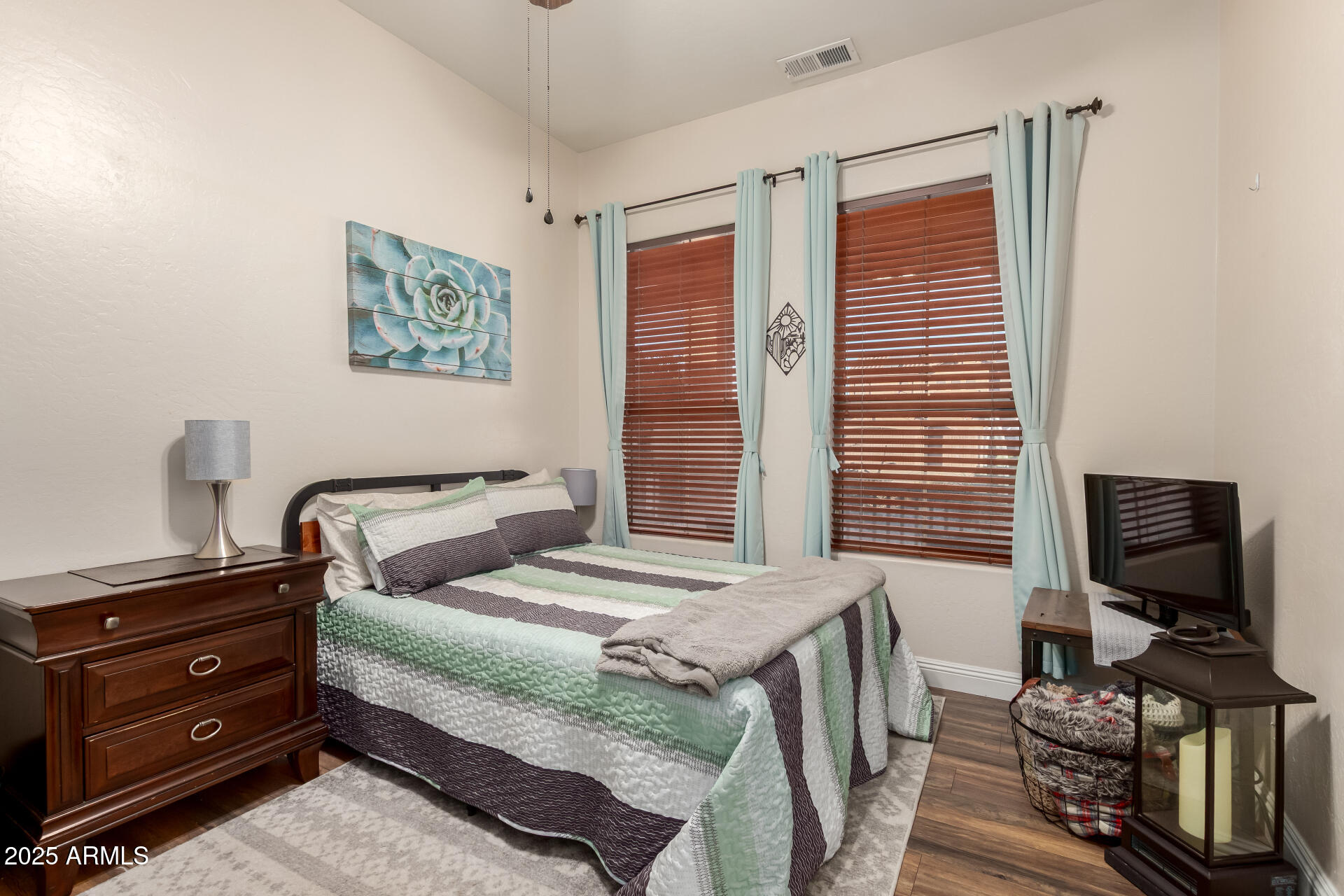 17441 West Arroyo Way Goodyear, AZ 85338 - Photo 6 of 27 a bedroom with a bed and furniture