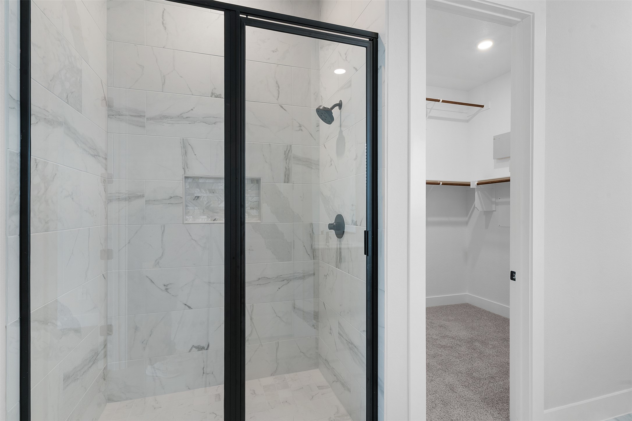 17308 Hope Bergman Road Pflugerville, TX 78660 - Photo 22 of 39 a bathroom with a glass shower door