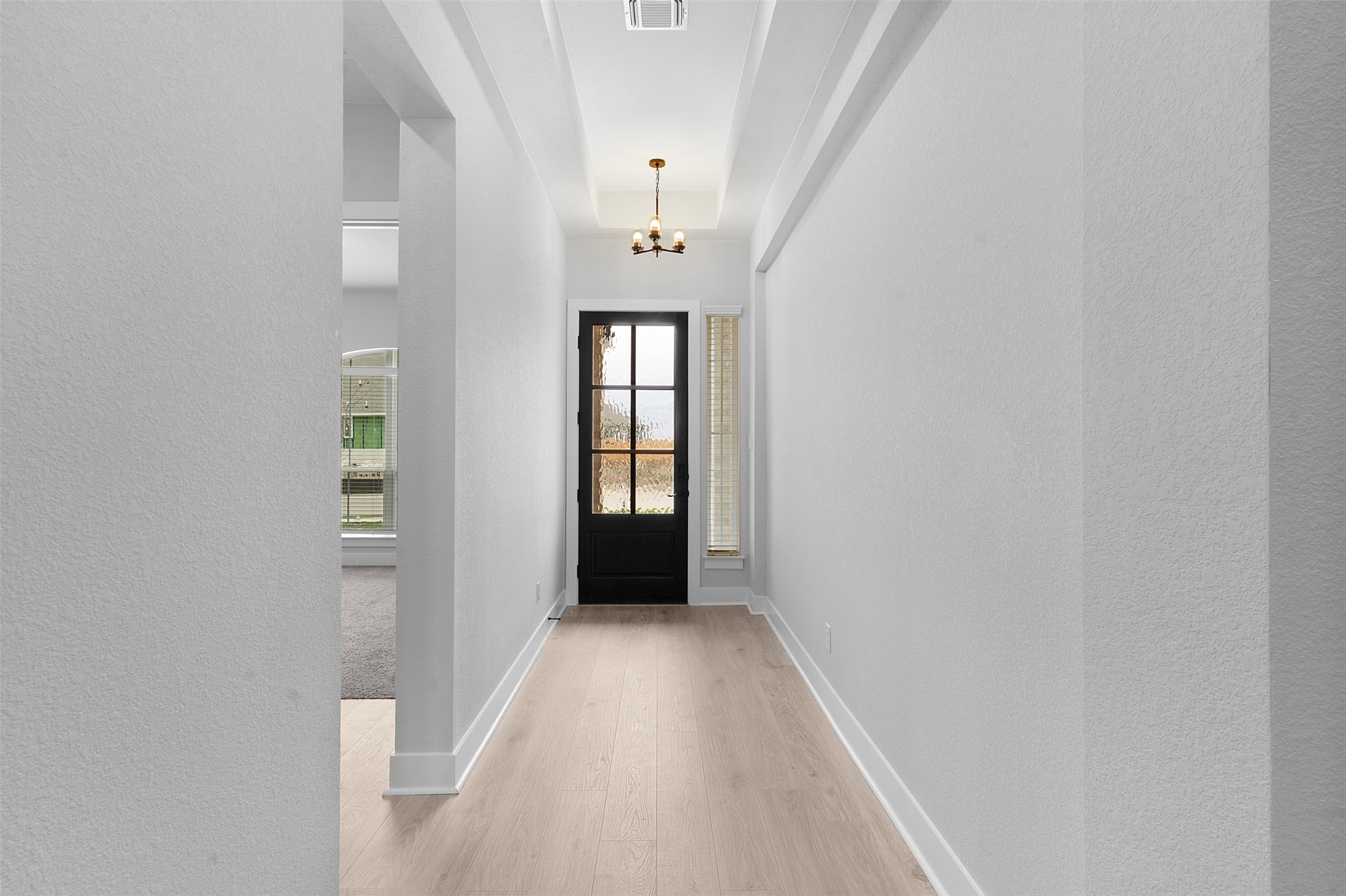 17308 Hope Bergman Road Pflugerville, TX 78660 - Photo 5 of 39 a view of a hallway with windows