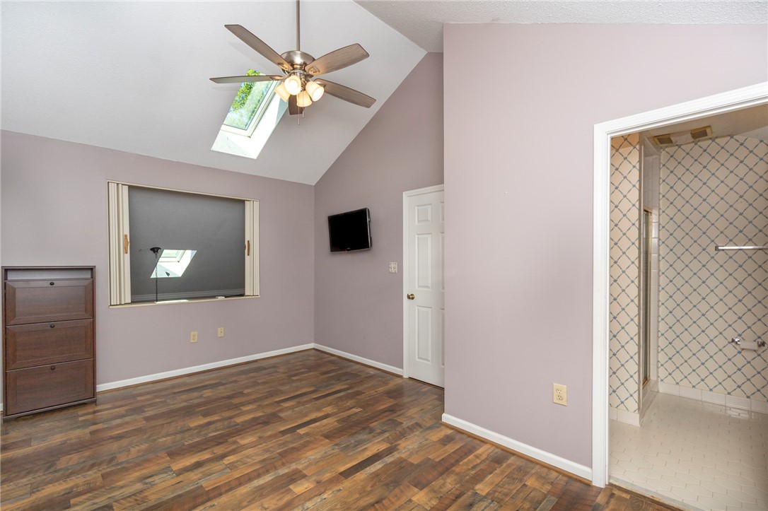 1302 Leeward Road Anderson, SC 29625 - Photo 19 of 50 A skylight brightens this room with vaulted ceilings and wood flooring.