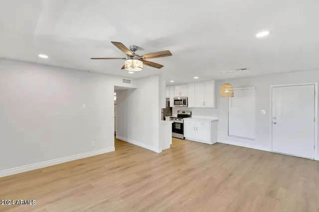 a view of a kitchen with a sink and a stove top oven