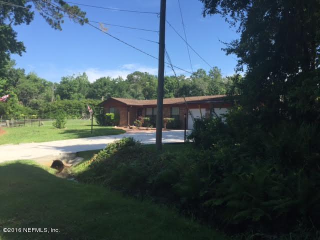 3039 Magnolia Road Orange Park, FL 32065 - Photo 6 of 7 a view of a house with a yard