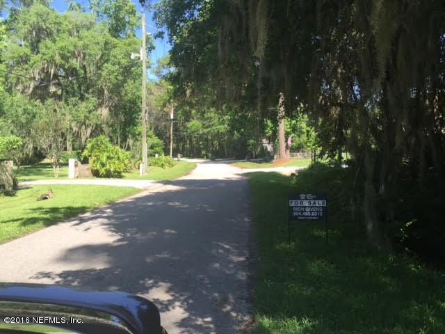 3039 Magnolia Road Orange Park, FL 32065 - Photo 7 of 7 a view of a street with a yard