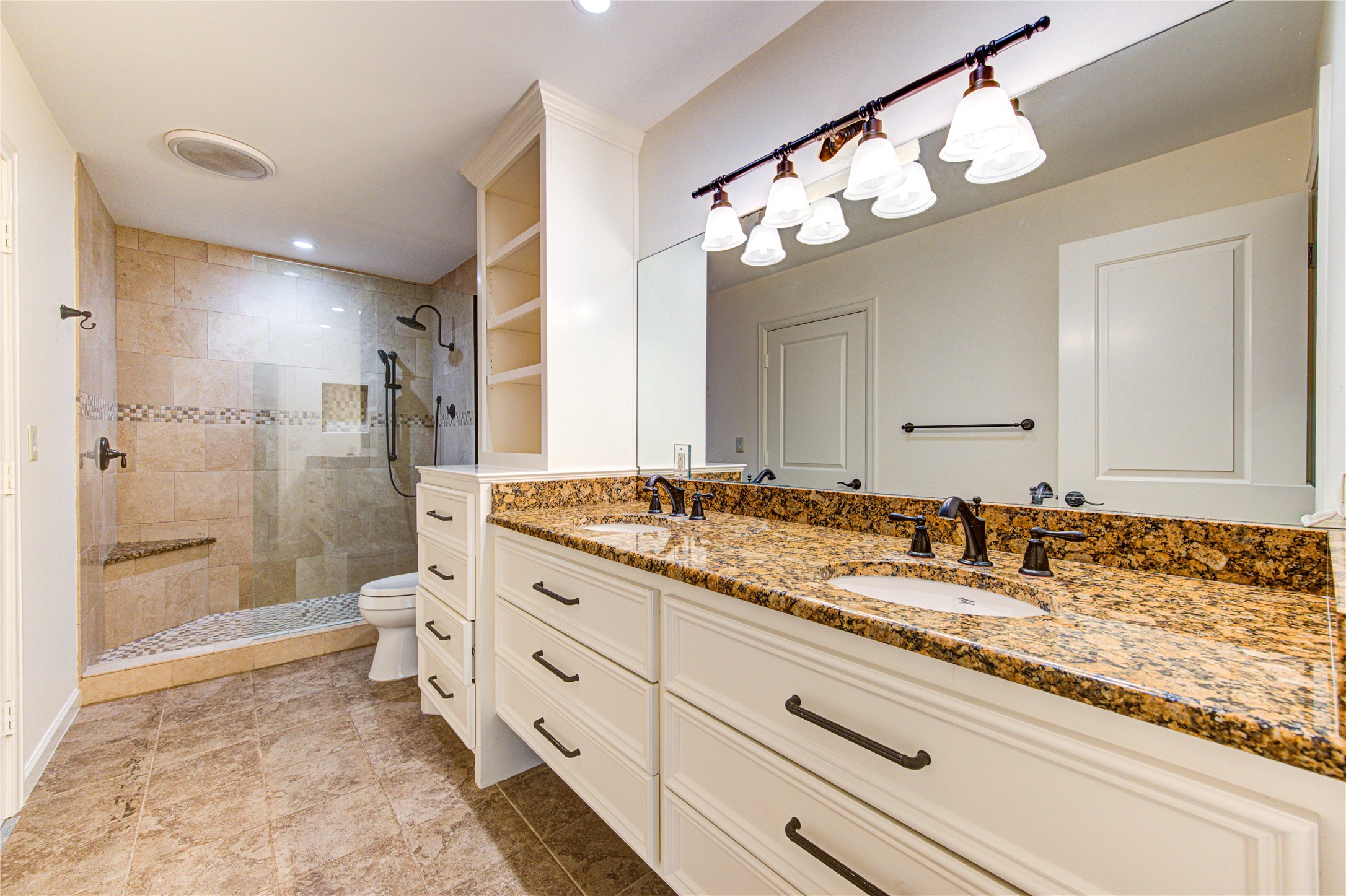 4615 Laurel Street Bellaire, TX 77401 - Photo 36 of 48 attached ensuite bathroom (could be 2nd primary) with double sinks and full walk-in shower.