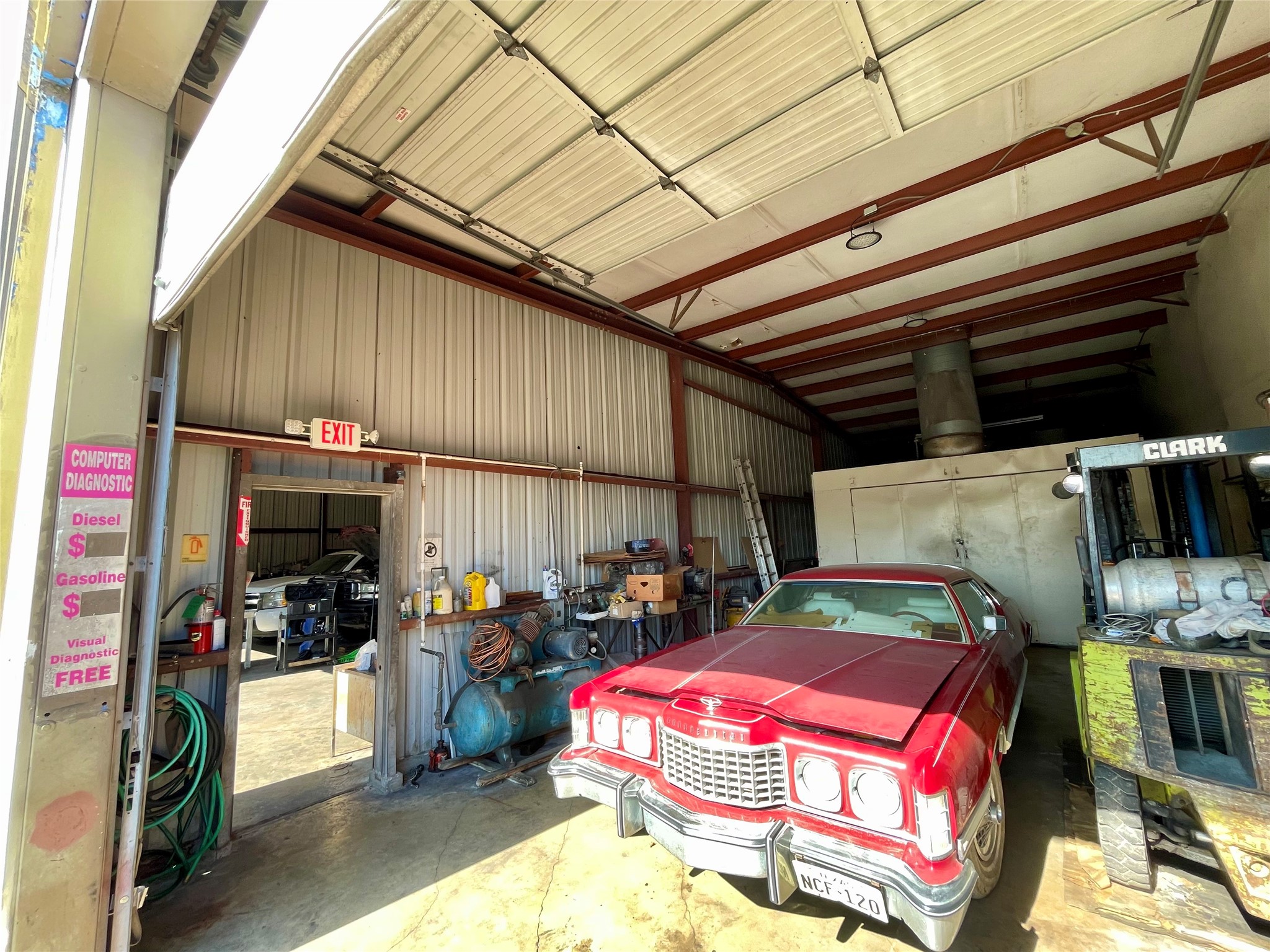 4711 Yale Street Houston, TX 77018 - Photo 8 of 10 a storage room with a table and chairs