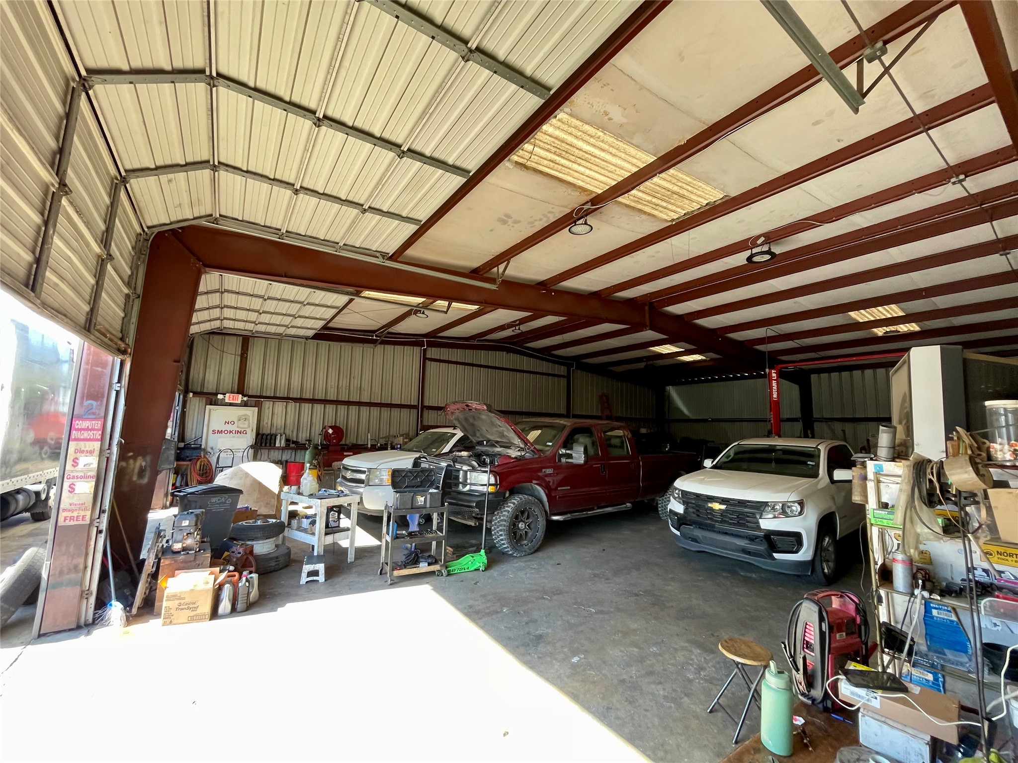 4711 Yale Street Houston, TX 77018 - Photo 9 of 10 a view of parking garage with cars