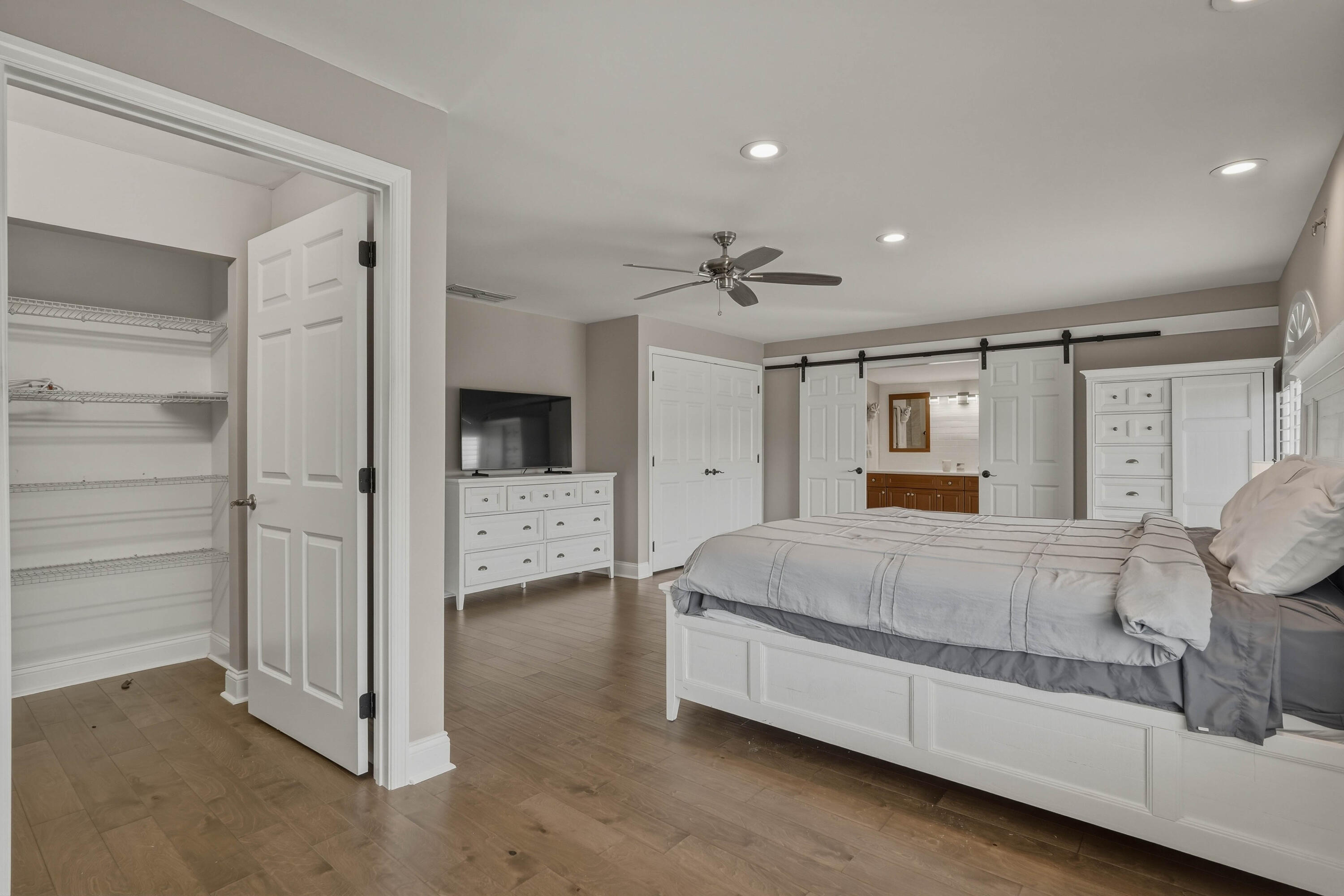 320 5th Street Key Colony Beach, FL 33051 - Photo 24 of 53 a spacious bedroom with a bed and a walk in closet