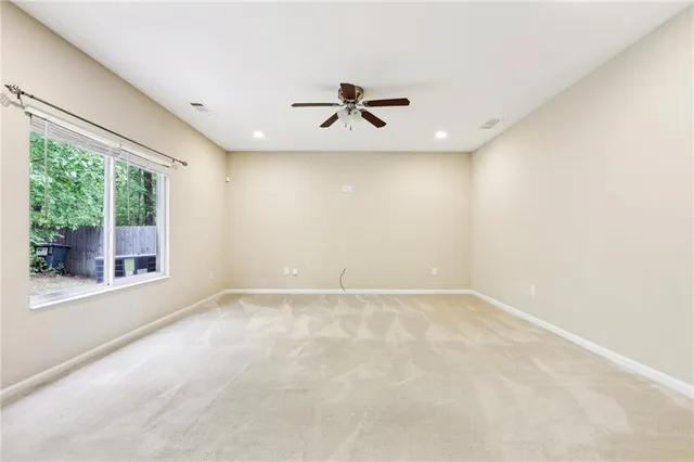 an empty room with windows and entrance