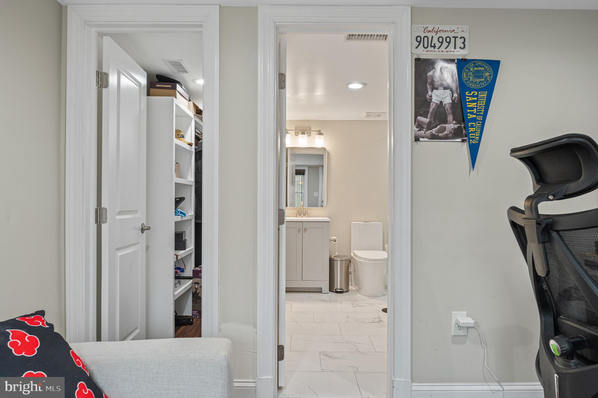 9217 Fowler Lane Lanham, MD 20706 - Photo 59 of 80 a view of a hallway with bathroom and front door