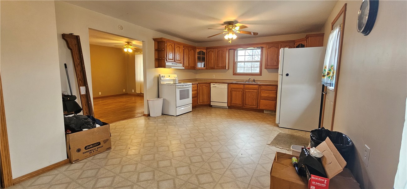 206 East Fifth Street St. Peter, IL 62880 - Photo 6 of 23 a view of a kitchen with fridge and workspace