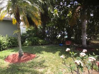10907 Gable Street Boca Raton, FL 33428 - Photo 9 of 40 a backyard of a house with swimming pool and outdoor seating