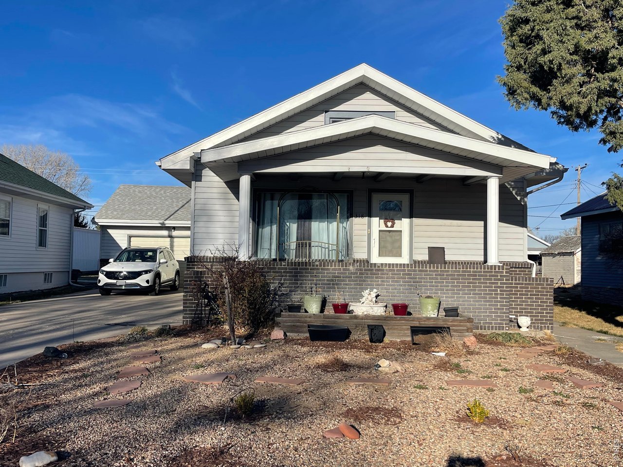 318 Iowa Avenue Stratton, CO 80836 - Photo 1 of 14 a front view of a house with parking space