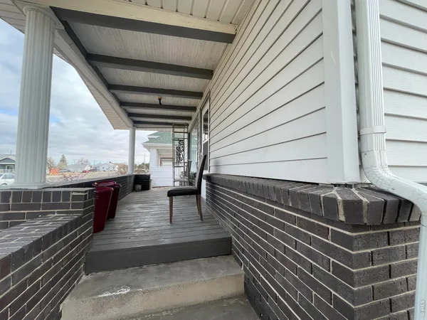 a view of a balcony with next to a wall