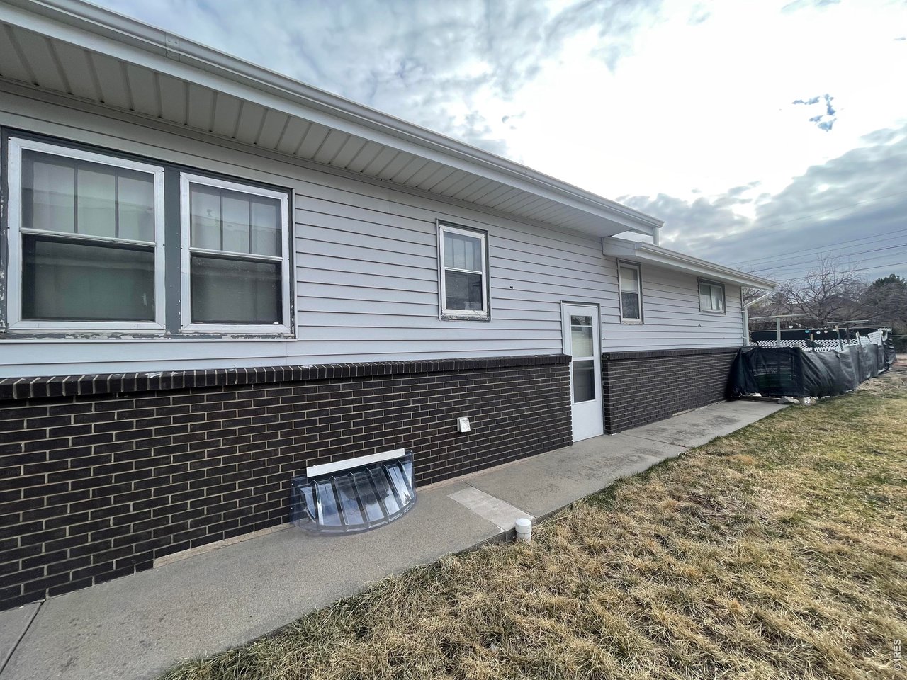 318 Iowa Avenue Stratton, CO 80836 - Photo 13 of 14 a view of a house with a door