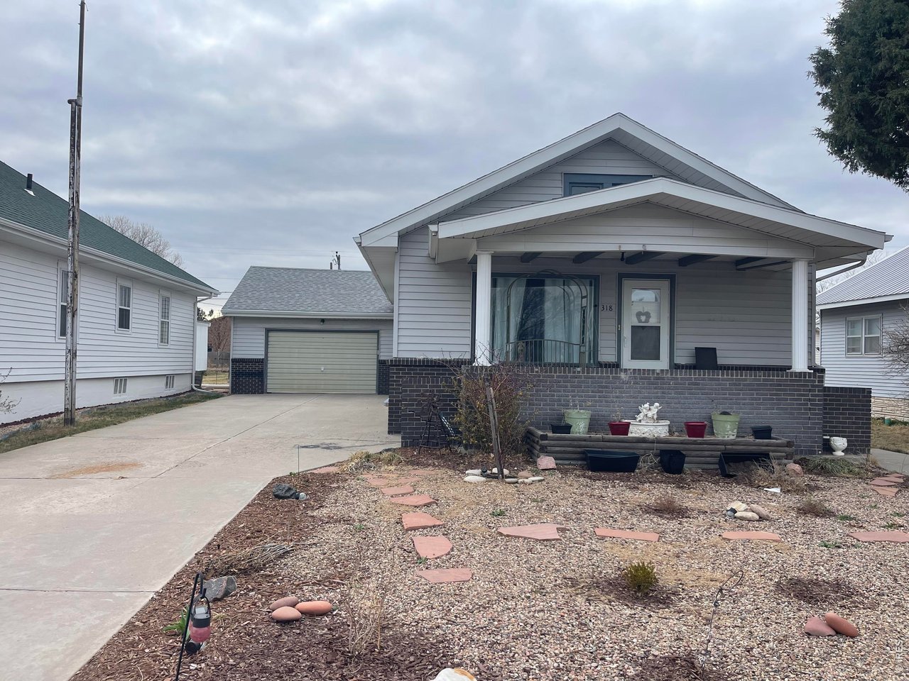 318 Iowa Avenue Stratton, CO 80836 - Photo 4 of 14 a front view of a house with cars parked