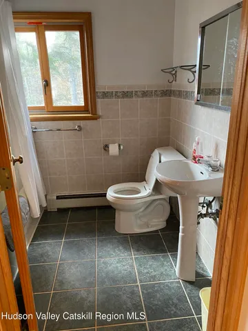 a bathroom with a toilet and a sink