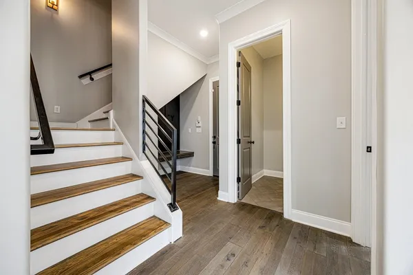 a view of front door with wooden floor