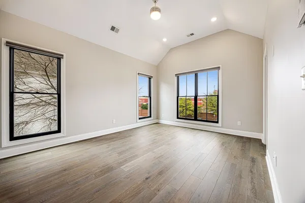 a view of entryway with wooden floor