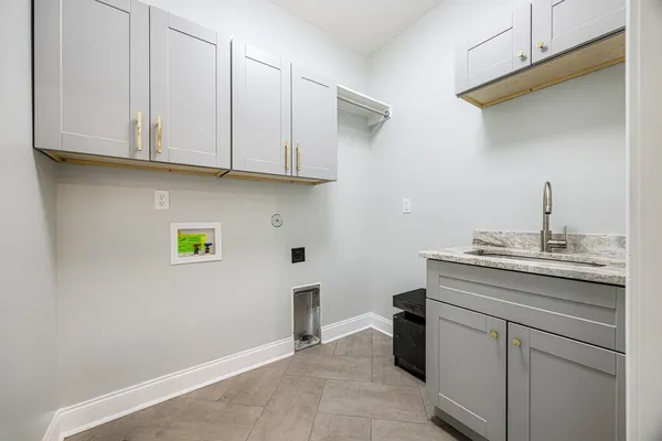a spacious bathroom with a bathtub sink and mirror