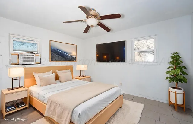 a front view of a house with a wooden fence