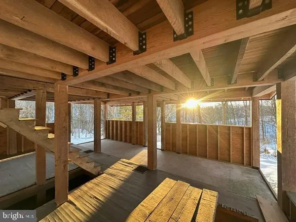 a view of a patio with table and chairs with wooden floor and fence
