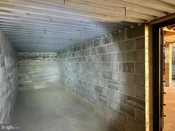 a view of an empty room with a wooden door