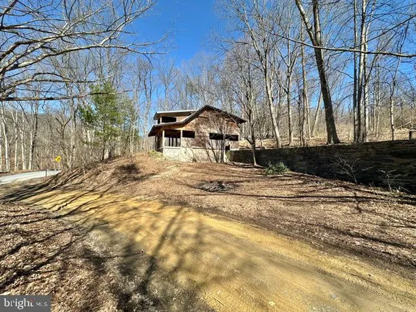 a house with trees in the background