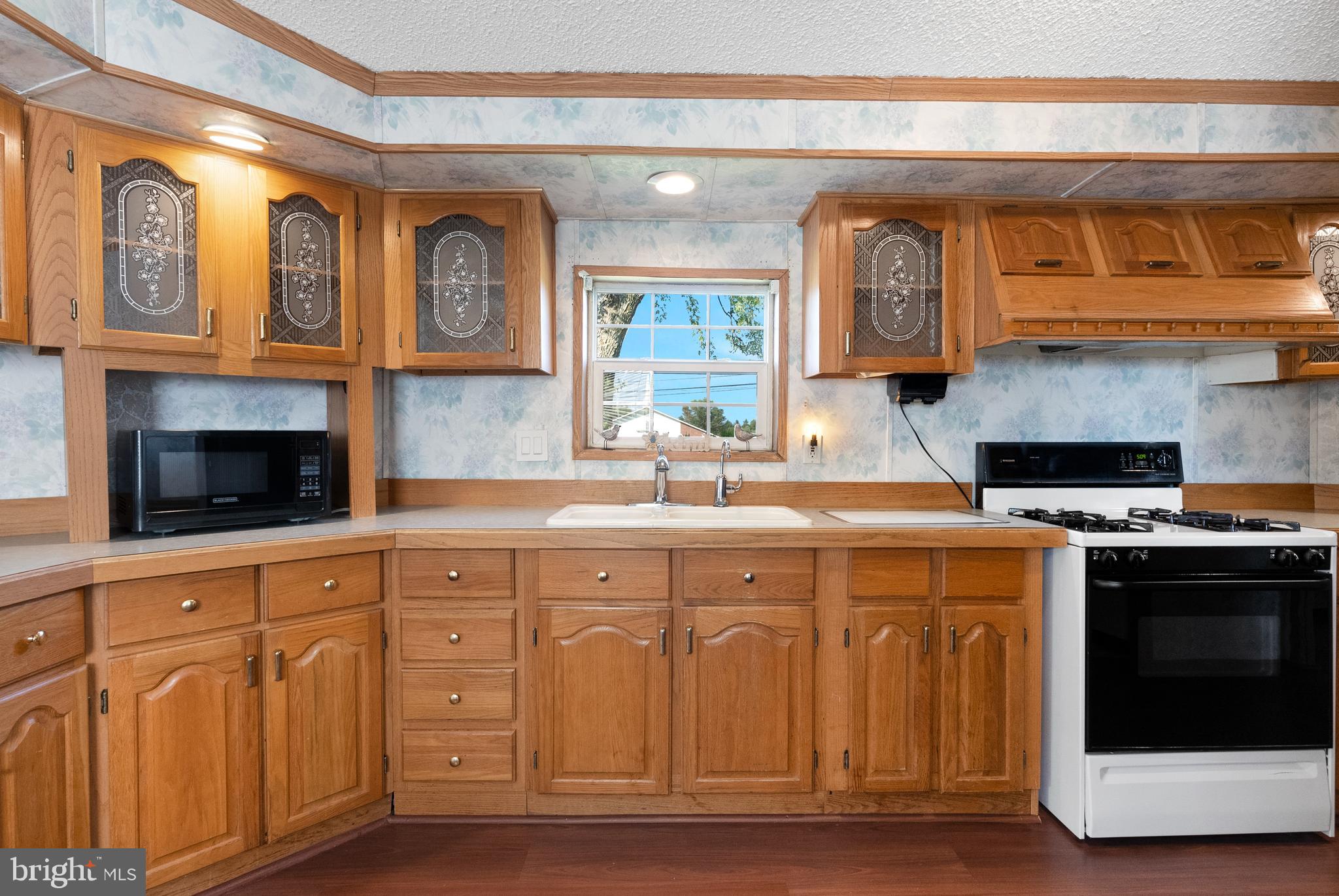 334 Ridge Road Spring City, PA 19475 - Photo 11 of 34 a kitchen with stainless steel appliances granite countertop a stove and a sink