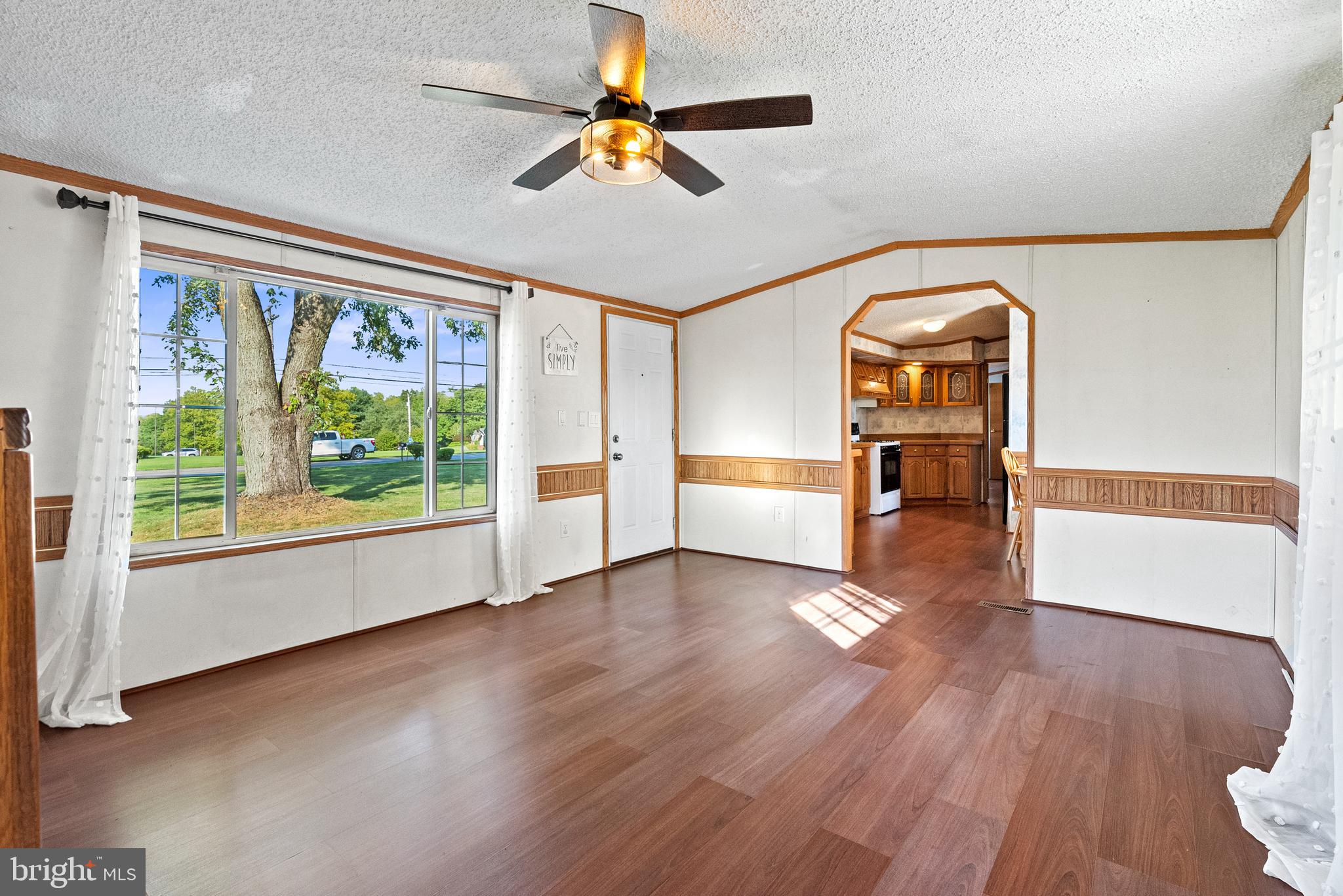 334 Ridge Road Spring City, PA 19475 - Photo 13 of 34 a view of empty room with wooden floor and fan