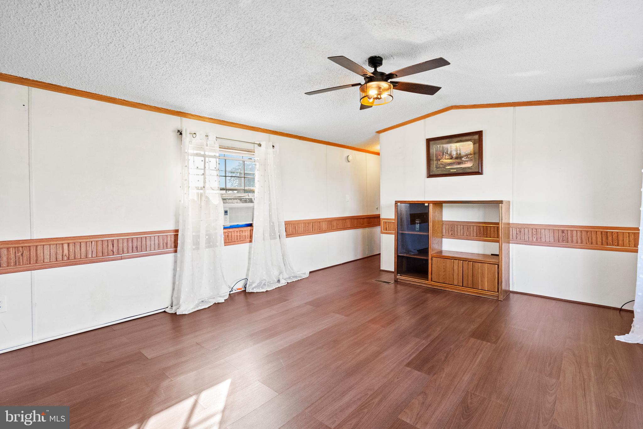 334 Ridge Road Spring City, PA 19475 - Photo 15 of 34 a view of a livingroom with wooden floor and a ceiling fan