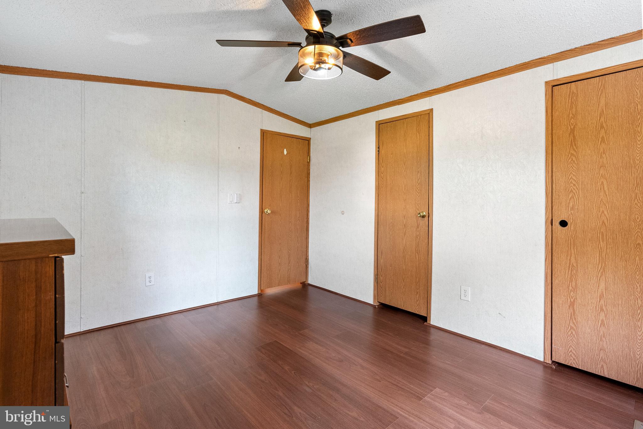 334 Ridge Road Spring City, PA 19475 - Photo 17 of 34 an empty room with wooden floor and a ceiling fan