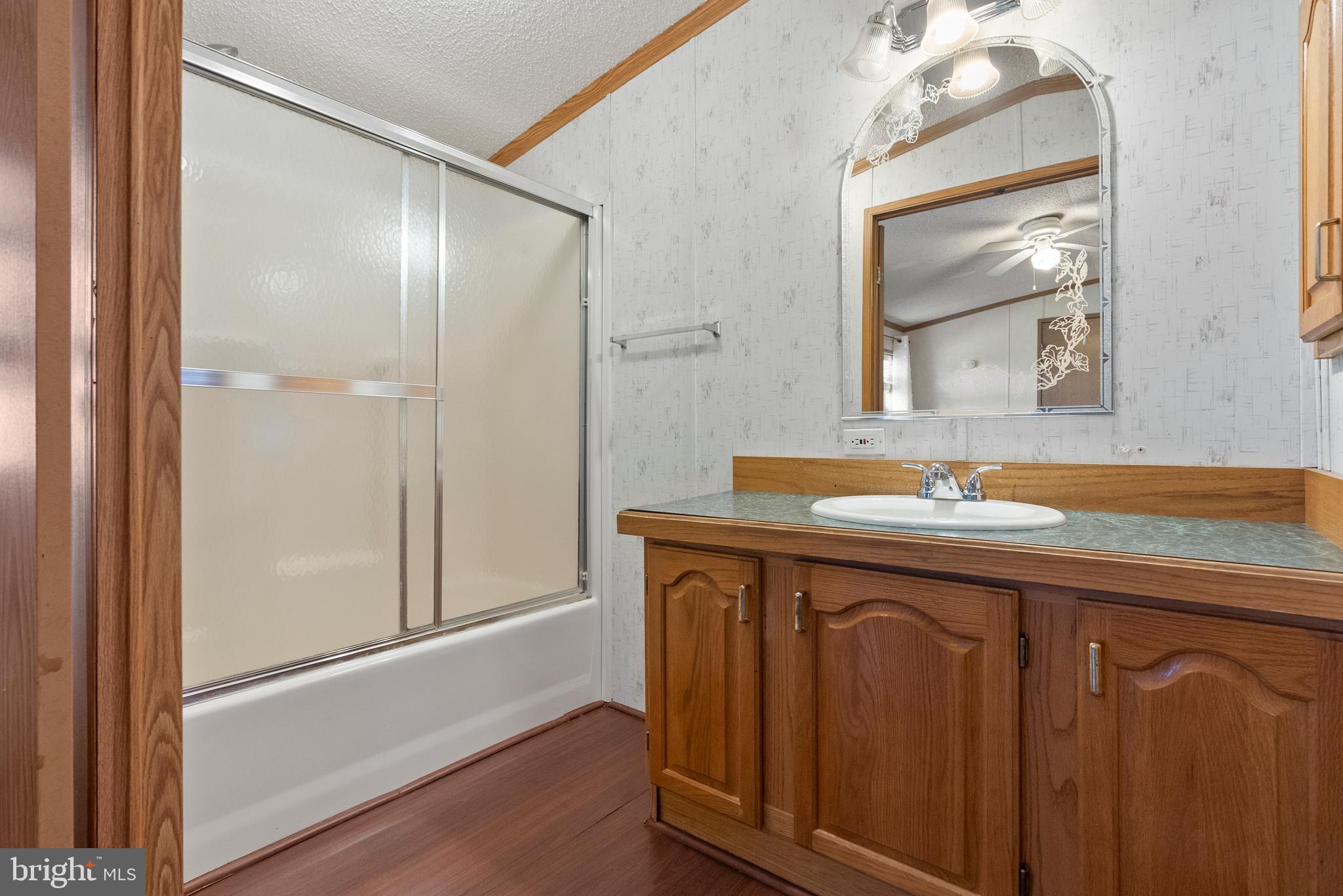 334 Ridge Road Spring City, PA 19475 - Photo 21 of 34 a bathroom with a granite countertop sink and a mirror