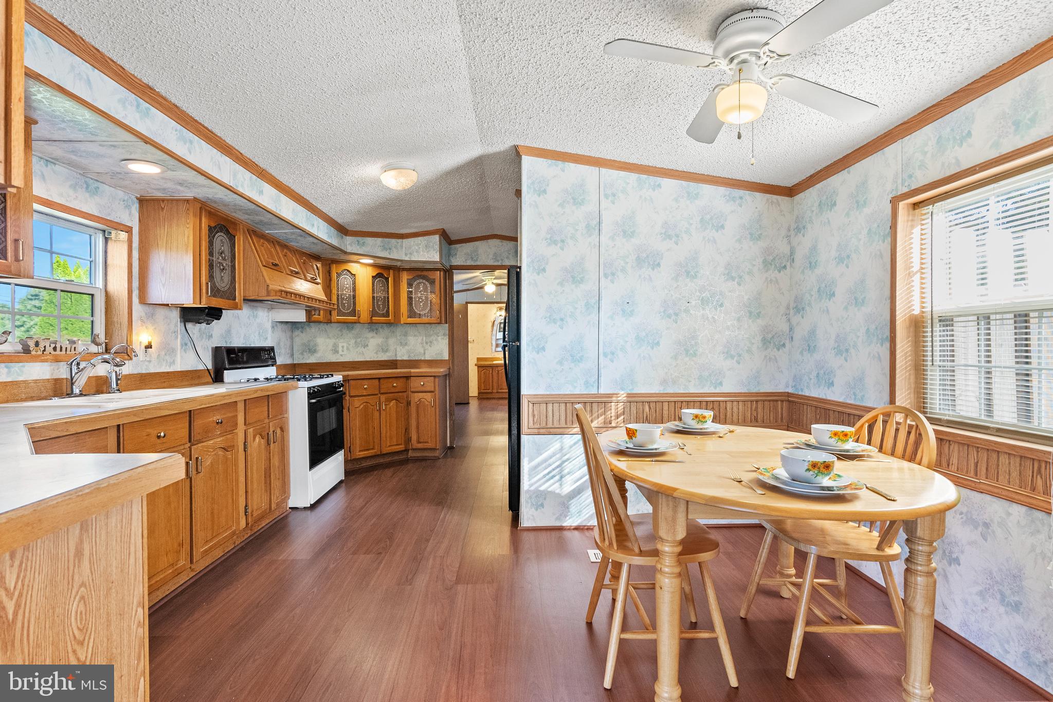 334 Ridge Road Spring City, PA 19475 - Photo 9 of 34 a kitchen with stainless steel appliances a table and chairs in it