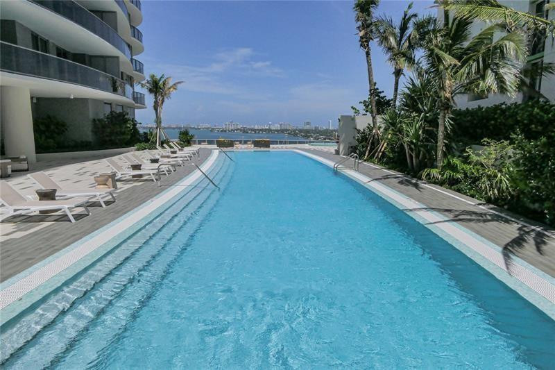 488 Northeast 18th Street, Unit 3503 Miami, FL 33132 - Photo 14 of 16 a view of a swimming pool with a yard
