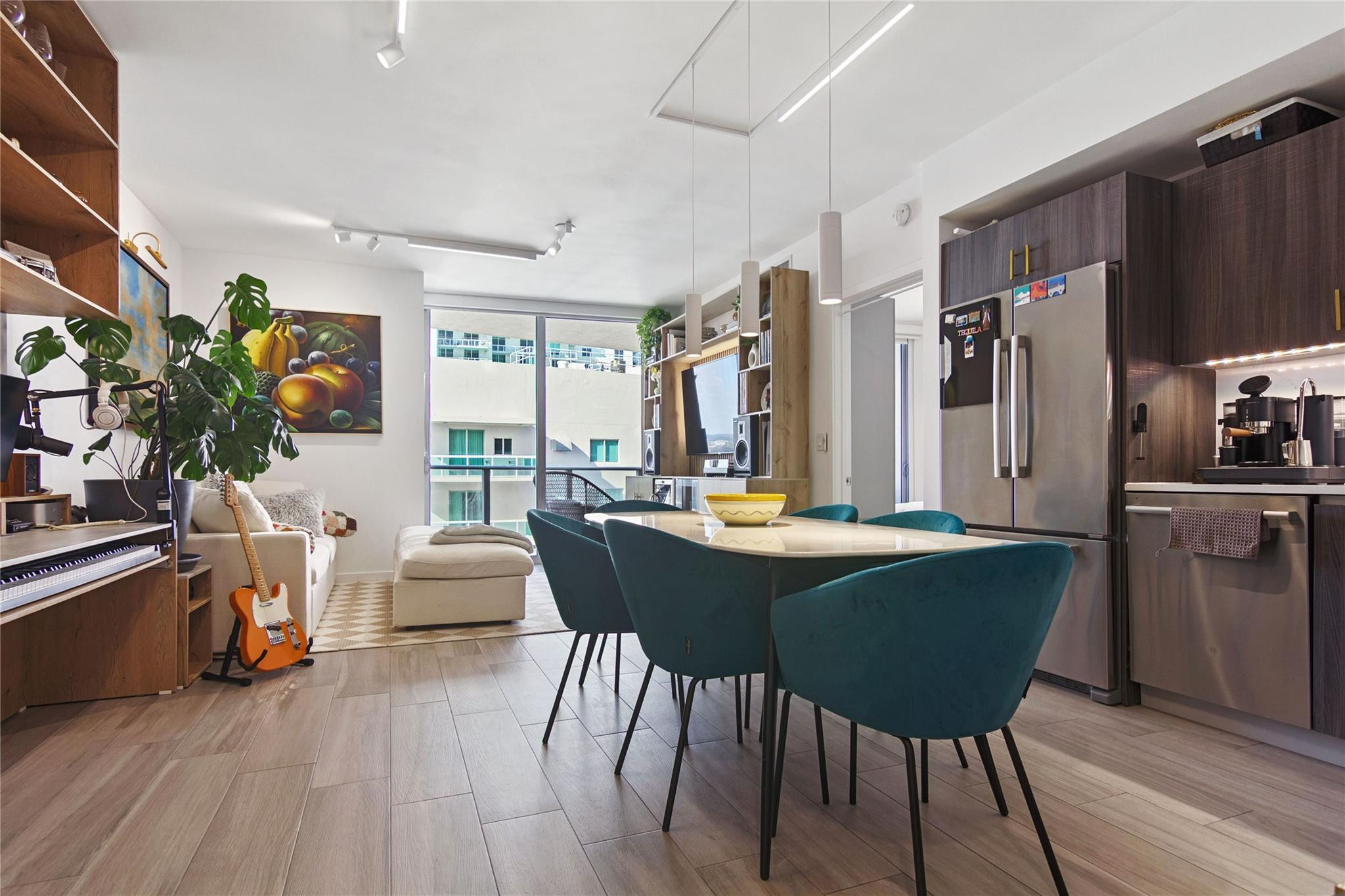 488 Northeast 18th Street, Unit 3503 Miami, FL 33132 - Photo 3 of 16 a view of a dining room with furniture and wooden floor