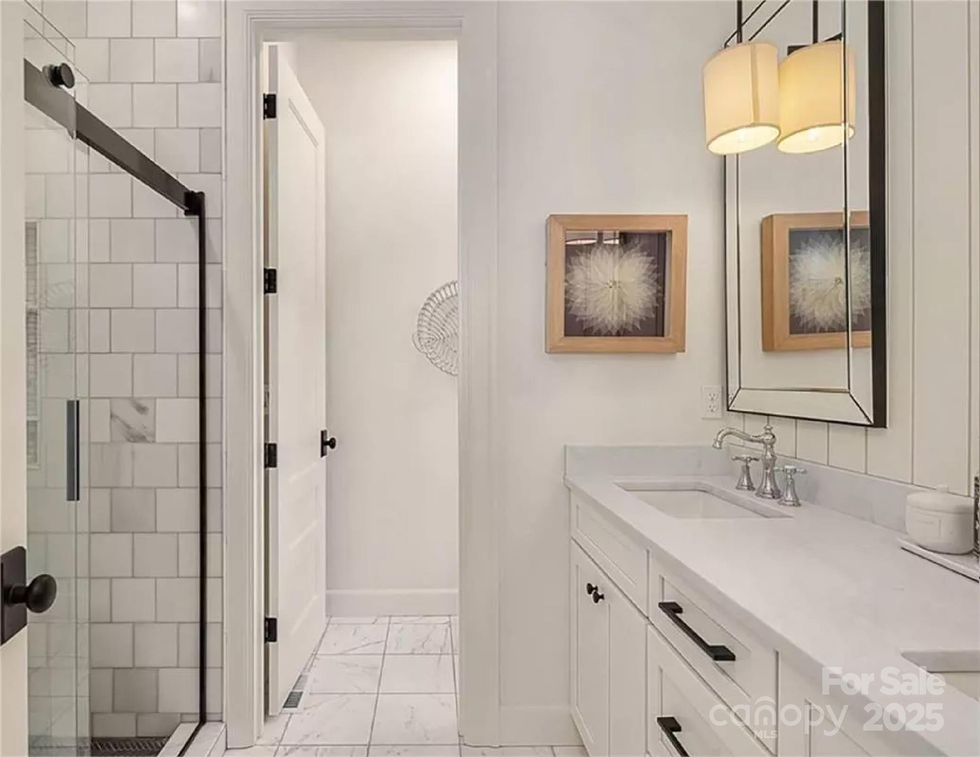 9490 Sherrills Ford Road Terrell, NC 28682 - Photo 15 of 24 a bathroom with a double vanity sink and a mirror