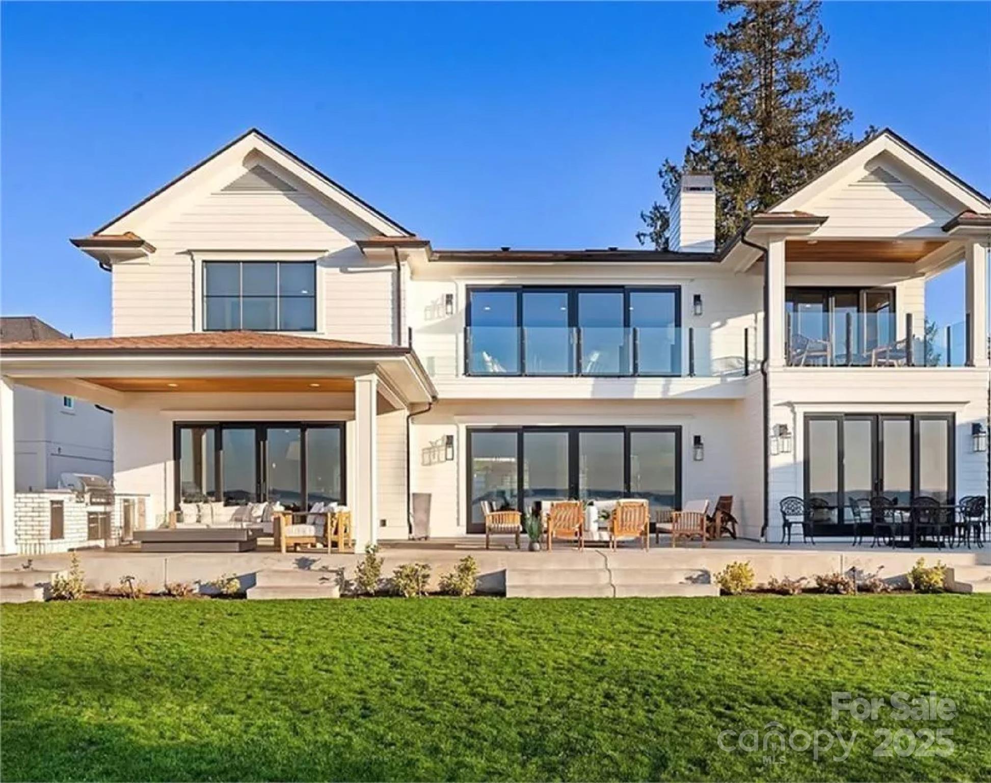 9490 Sherrills Ford Road Terrell, NC 28682 - Photo 3 of 24 a front view of a house with a yard table and chairs