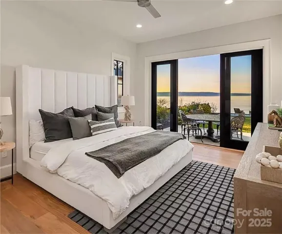 a bedroom with a large bed and a large window