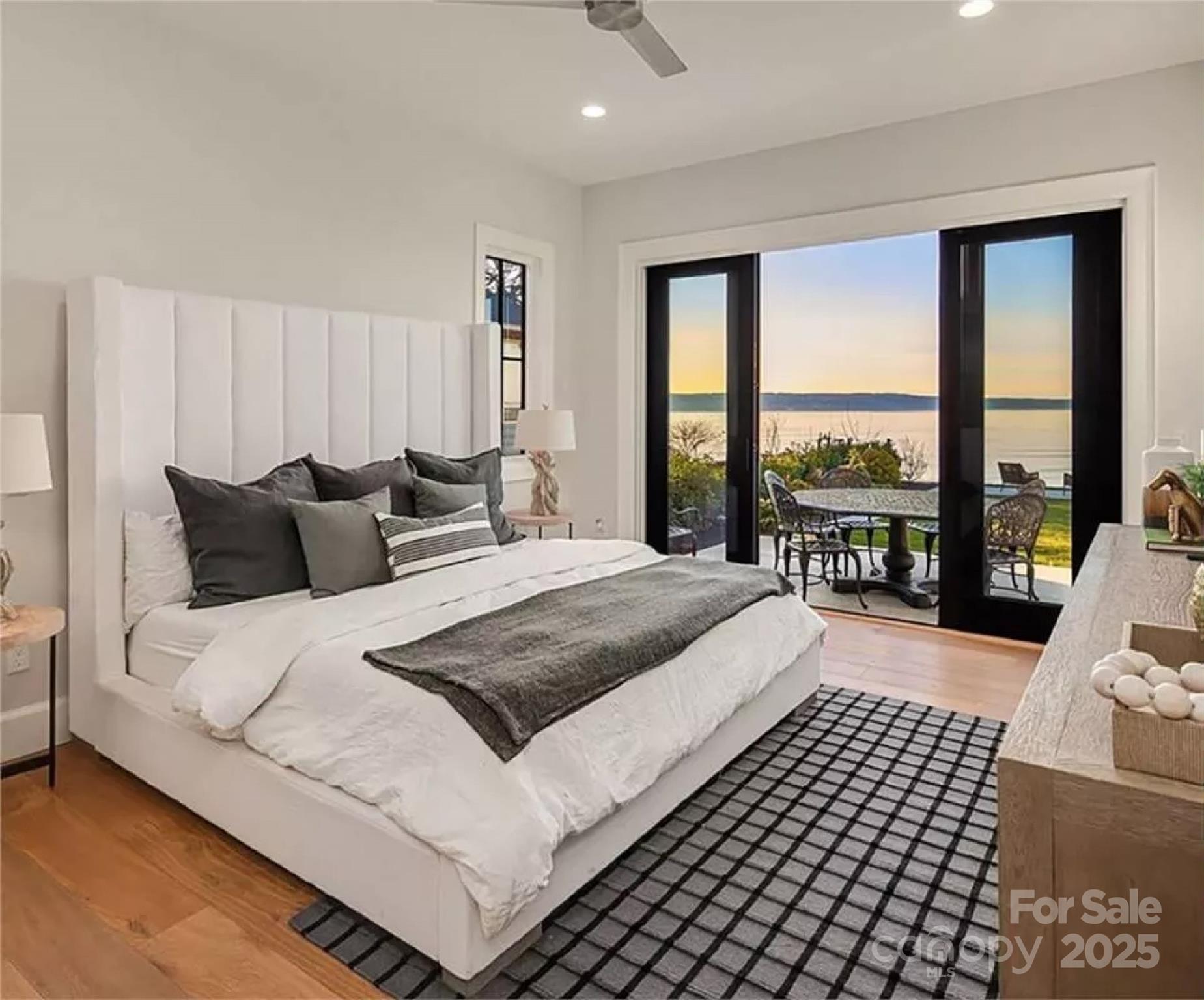 9490 Sherrills Ford Road Terrell, NC 28682 - Photo 4 of 24 a bedroom with a large bed and a large window