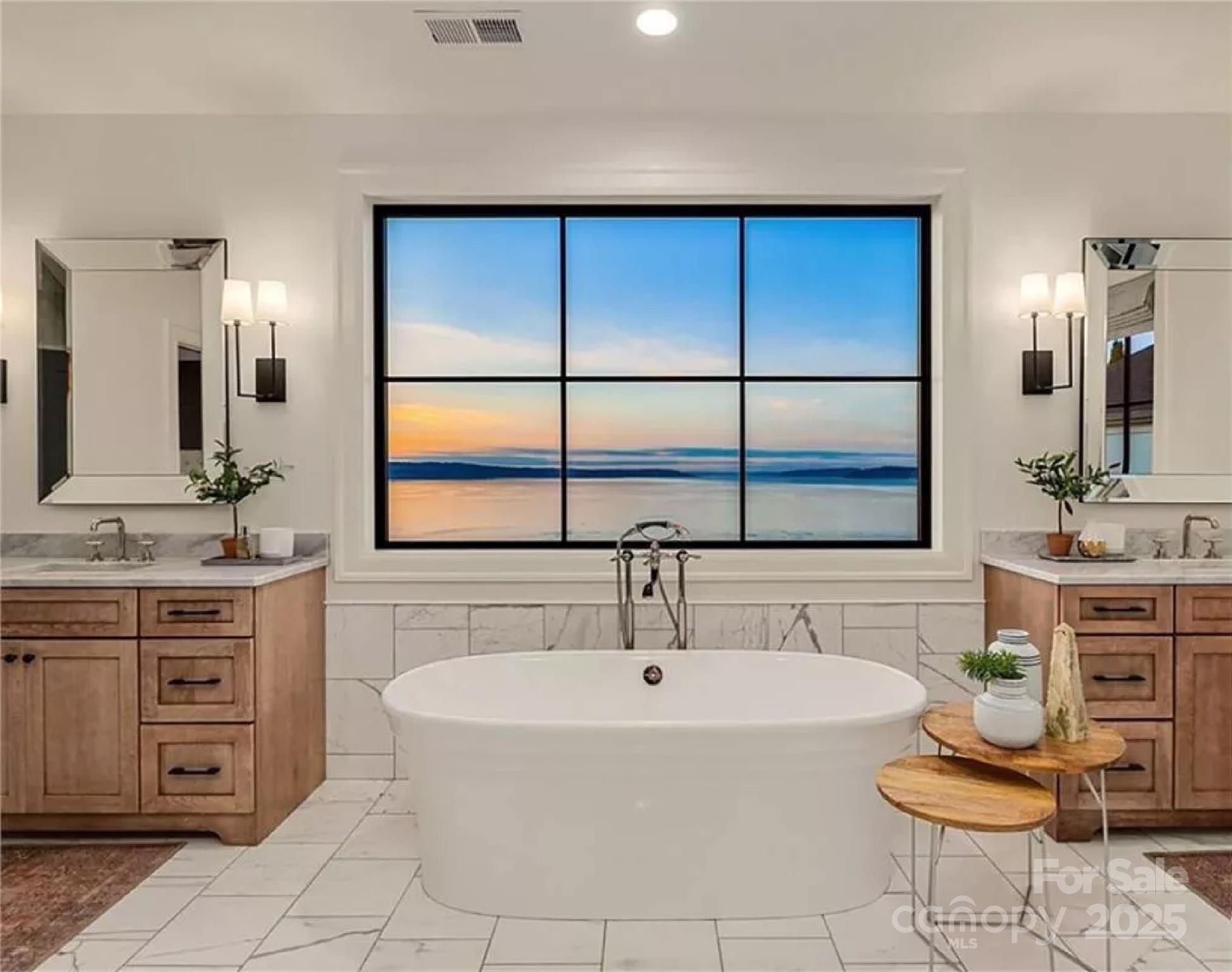 9490 Sherrills Ford Road Terrell, NC 28682 - Photo 10 of 24 a bathroom with a double vanity sink a mirror a bathtub and vanity